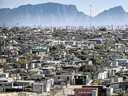 Khayelitsha and shakes where people live in poor conditions, a township close to Cape Town, South Africa