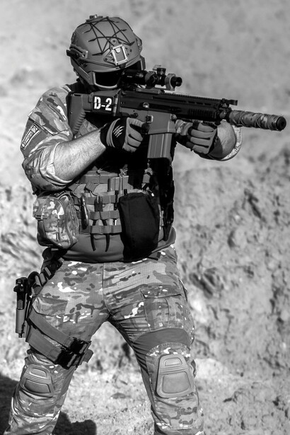 Soldier with a D2 gun preparing for combat