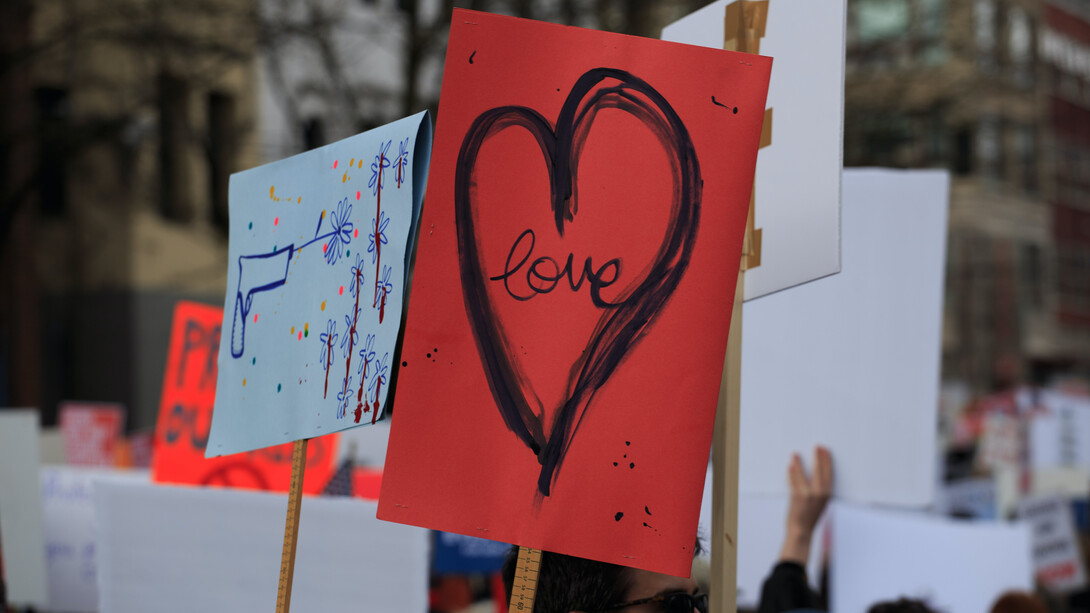 A placard with the word love written on it
