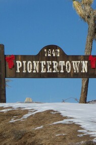 Sign at the town limits of Pioneertown, California, USA, an unincorporated town in San Bernardino County