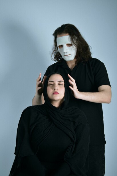 Mysterious setting with a masked figure beside a woman