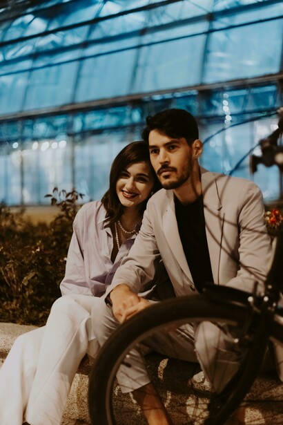 A couple sitting on a street bench while having a meaningful conversation