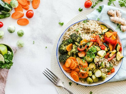 A nutrient-rich meal bursting with fresh produce, symbolizing how a balanced diet helps nourish hair from within