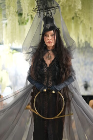 Madonna in custom Saint Laurent by Anthony Vaccarello, wearing a dramatic black lace ensemble with a sculptural ship-inspired headpiece and flowing veil during the 2026 Met Gala