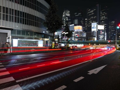 In the blur of lights, we glimpse a world accelerating faster than our minds can fully grasp