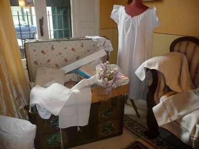 Linen dresses in a garret with old furniture