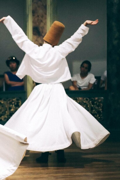 Audience observes a dervish whirl