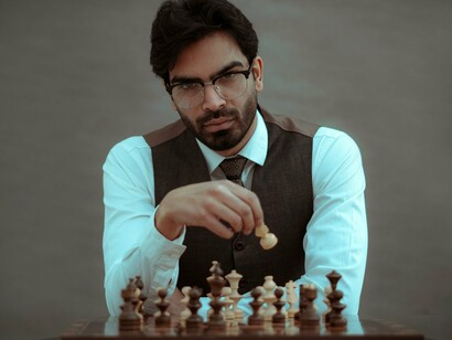 A chess player weighing each option with patience, symbolizing the discipline needed to achieve long-term goals