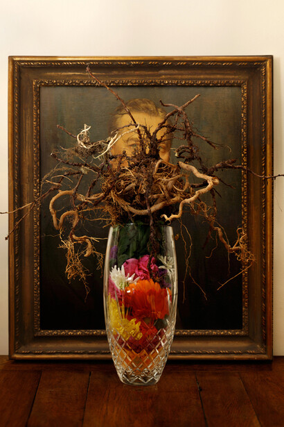 Organs, 2013 © Jonny Briggs, Upturned bunch of flowers obscuring portrait of Grandfather 89 x 97cm Photography; C-type Lambda print, mounted and box framed in brown