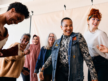 Portrait of cheerful multi-ethnic women from different generations, celebrating diversity, inclusion, and friendship