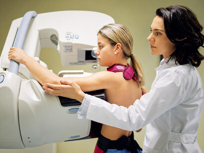 Radiologist conducting a mammography screening with modern diagnostic imaging technology