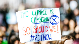 A sing at a demonstration urging for action against climate change