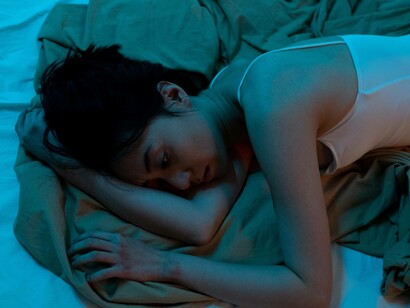 A woman trying to make sense of her grief while in bed