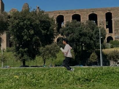 Sara Terracina jogging with determination at Circus Maximus in Rome