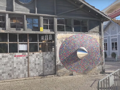 LX Factory in Lisbon, a former industrial site now thriving as a cultural and entrepreneurial center, successfully integrating its historical character with contemporary design to attract artists, businesses, and tourists