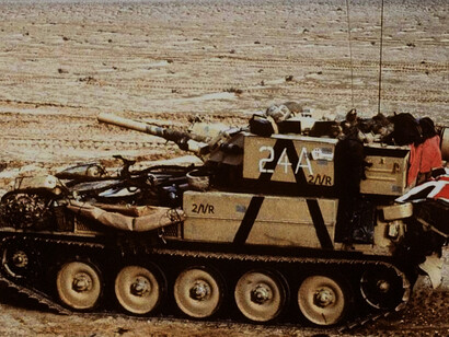 A Scorpion reconnaissance vehicle from the 7th Brigade, Royal Scots, 1st United Kingdom Armoured Division advances east into Kuwait from southern Iraq during Operation Desert Storm