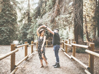 A man twirling around a woman in a generic but heartfelt dance motion