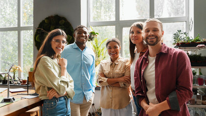 Colleagues brainstorm innovative solutions for reducing carbon emissions, highlighting how sustainability is sparking fresh ideas across industries