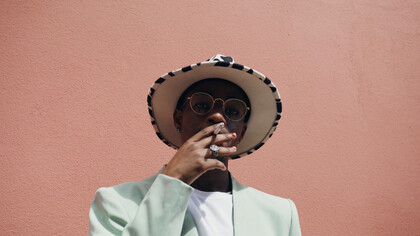 Basking in the sun, he reflects the allure of a lifestyle that increasingly intertwines with nicotine culture in urban Kenya