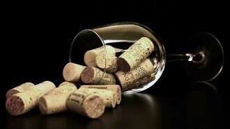 Brown wine corks gathered inside a clear glass