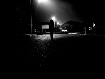 Light and shadow collide as a silhouette emerges from the darkness, representing how facing our unconscious self is the first step toward true transformation