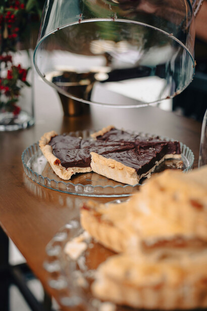 Indulge in a tempting spread featuring chocolate cake and apple pie, perfect for enhancing your dining experience