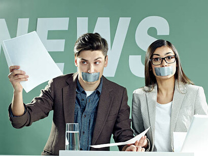 Television censorship depicted through two reporters with their mouths taped shut