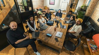 A diverse tech team collaborating in a modern workspace