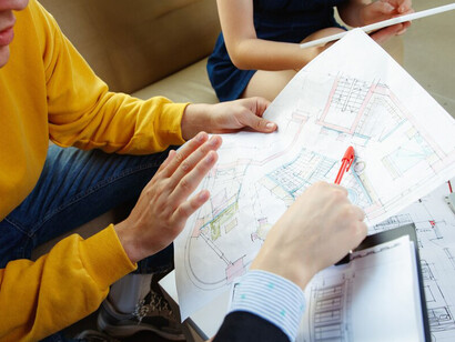 An architect focuses on a project design, blending functionality and aesthetics to create sustainable spaces that meet community needs