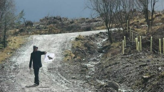 Photograph from The Nation//Live – Civil War
A participant with a banner at the site of Covenanters’ graves, Bad’s Knowe, Galloway,
© National Galleries of Scotland and Atlas Arts 2013