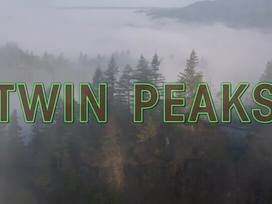The Twin Peaks title card hints at the show's exploration of the hidden darkness beneath the surface of a seemingly idyllic town
