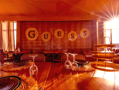 Guess is reshaping the White Camel Resort in Morocco’s Agafay Desert into a setting that mirrors the brand’s current narrative direction