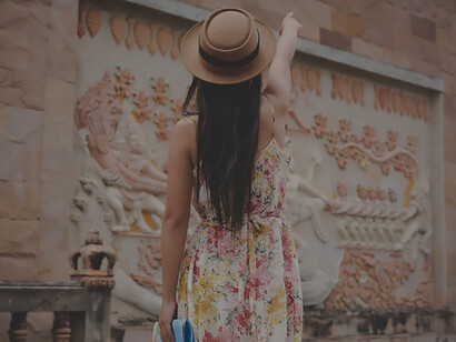 A quaint old town, a girl is captivated by cultural experiences as she navigates with a tourist map, uncovering enchanting travel destinations