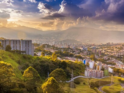 The city of Medellín sitting in the Aburrá Valley, symbolizing Colombia’s natural beauty and economic progress