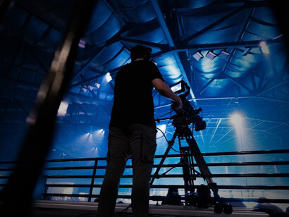 A stage technician adjusting lights before a progressive rock concert