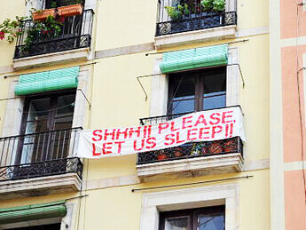 Neighbors in the Barceloneta neighborhood of Barcelona voice their frustrations over holiday apartments overflowing onto balconies, as the surge in tourism exacerbates the housing crisis and drives up rental price