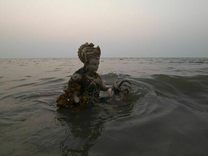 Waves crashing an idol  
