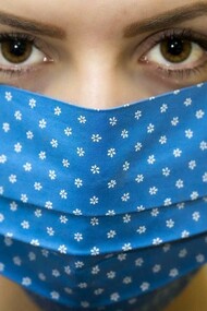 A masked woman stared the coronavirus pandemic crisis in the eyes as she tackled her day