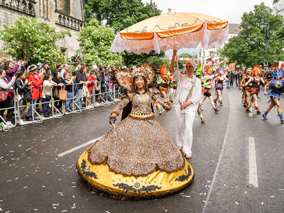 A performer wears an eccentric hoop dress