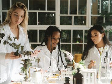 Researchers conducting experiments in a modern laboratory, reflecting the human drive to understand the natural world 