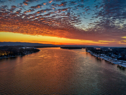 The landscapes of Kellogg and the Mississippi river captured from above at sunset, reflecting the beauty of journeys both inner and outward