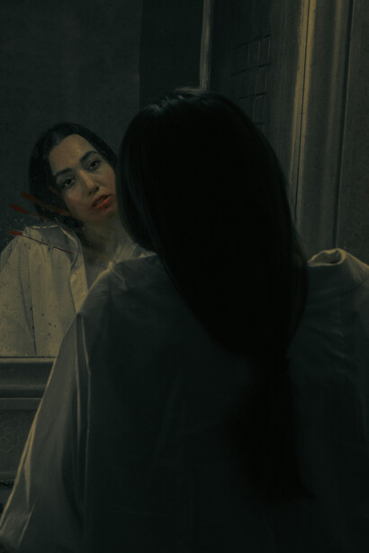 A melancholic woman standing before a mirror, confronting her thoughts in silence