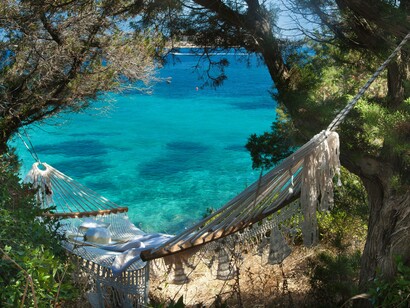 A hammock close to the sea is just another way to relax and contemplate taking a dip in one of the more secret areas of Capo d'Orso, Sardinia