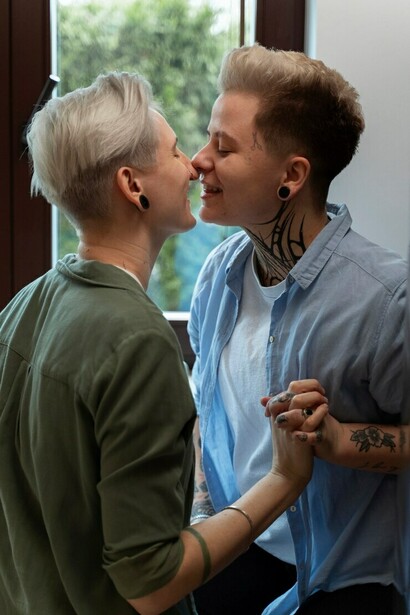 A romantic LGBTQ+ couple at home, sharing a tender moment as lovers, embodying love and intimacy while demonstrating the trust that strengthens their relationship