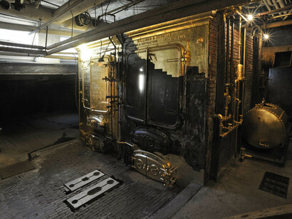 Saul Melman: Central Governor
Saul Melman’s installation is the result of a six-month-long performance during which he chiseled 5,000 pounds of salt block and covered MoMA PS1’s old boiler with gold leaf. Melman transformed the massive structure into a gilded object, making allusions to the alchemical properties that have been long associated with salt and gold. Central Governor was originally presented in the 2010 Greater New York exhibition in conjunction with Aki Sasamoto and her performance and installation Skewed Lies (2010).

Saul Melman. Central Governor. 2010. © 2017 Saul Melman. Photo: Martin Seck