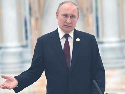 Russian President Vladimir Putin in the Kremlin taking questions from reporters