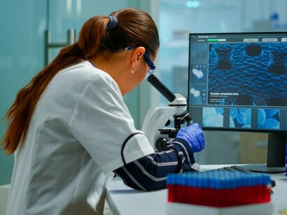 A researcher explores digital biological data, highlighting the immersive R&D that underpins integrated security and economic sovereignty