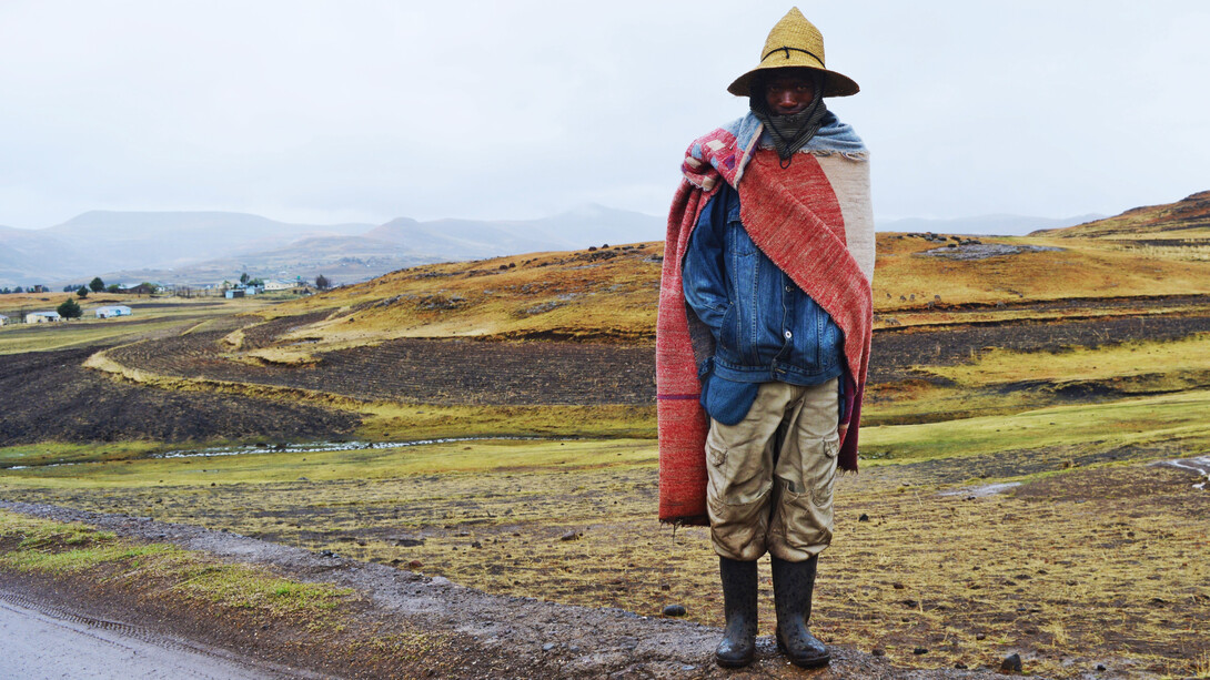 A Lesotho herder wears a Basotho blanket, a covering commonly worn, which has become a national symbol
