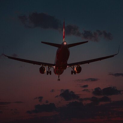 Plane landing at sunset. Human-generated sound is the industrial and technological noise that has engulfed our modern world