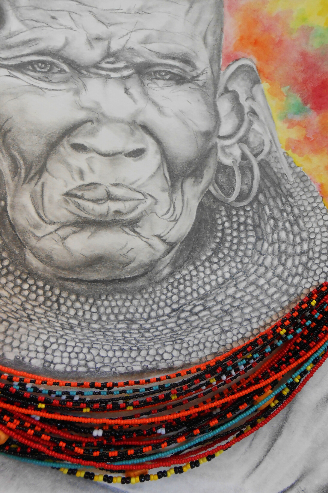 Maasai Woman, Mackenzie Traut, Age 17, Grade 12, Tottenville High School, Staten Island, Art Teacher: Wynter Carnevale, Watercolor, graphite, and strung beads on paper. Courtesy New York City Department of Education